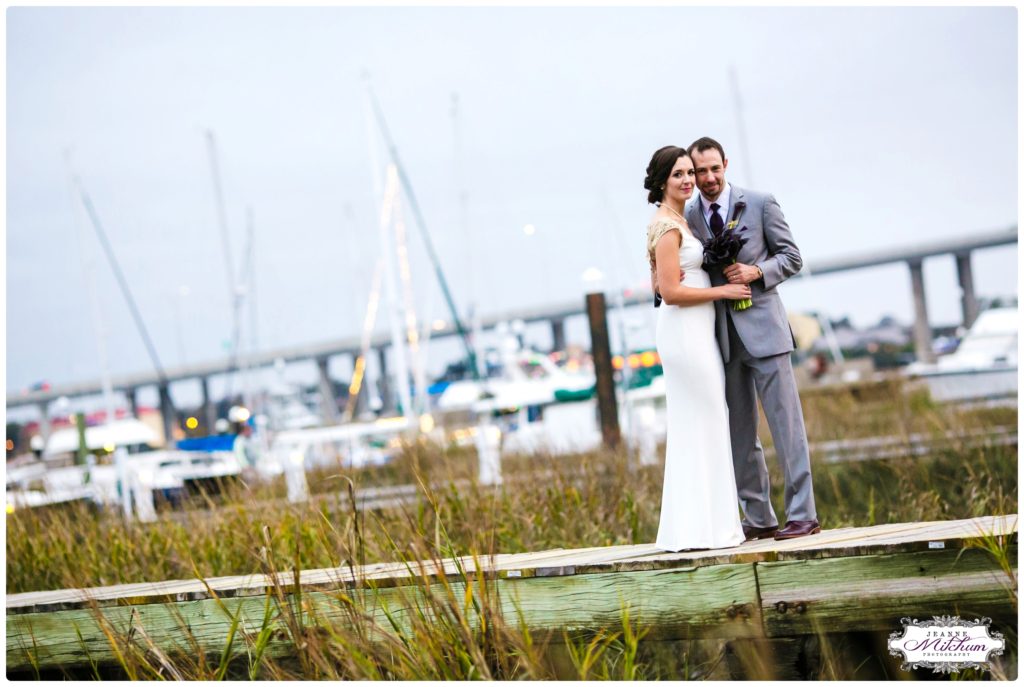 bride and groom on dock at the rice mill