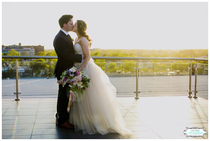 bride and groom on a rooftop in Charleston 